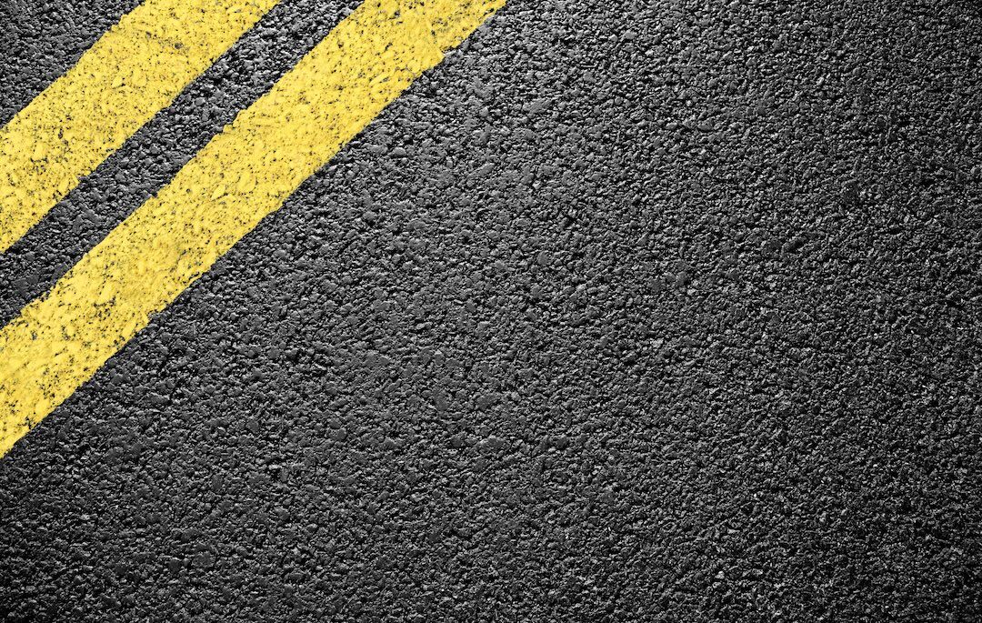Close-up of fresh yellow parking lot markings in Dallas–Fort Worth, TX — Blackland Asphalt
