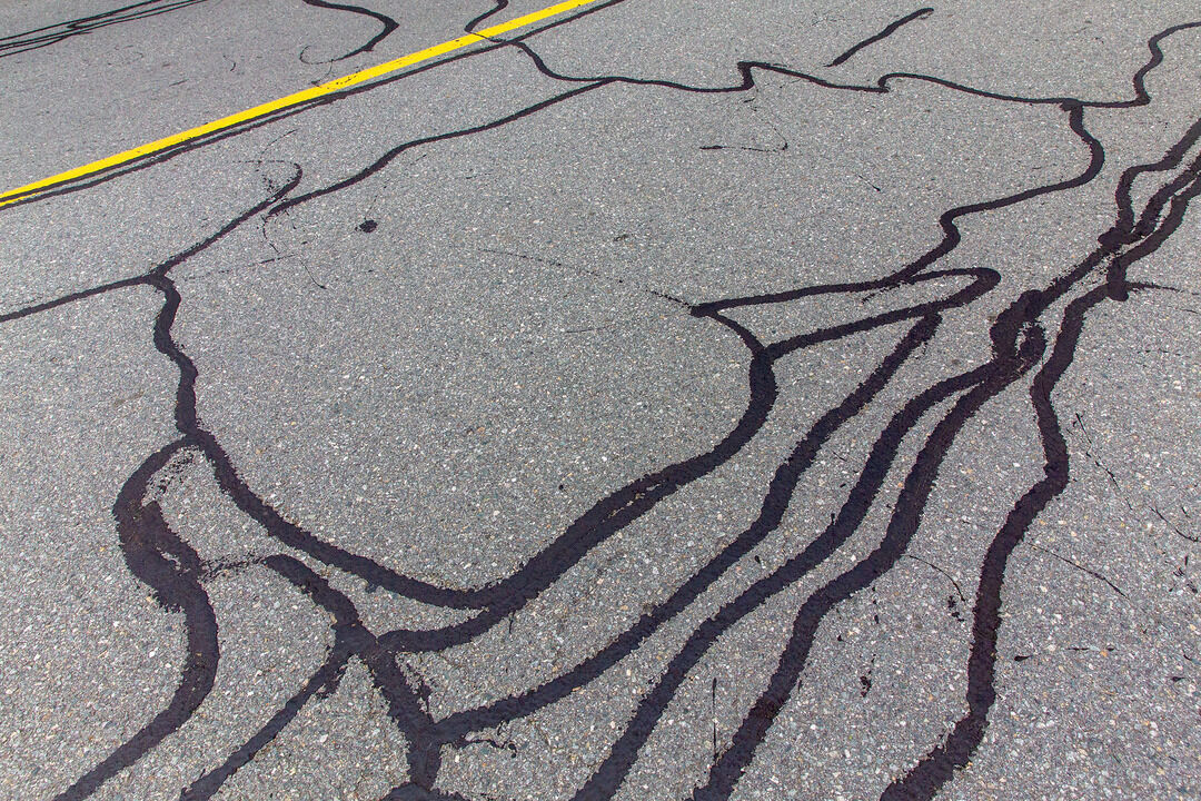 Close-up of filled asphalt cracks in Dallas–Fort Worth, TX — Blackland Asphalt
